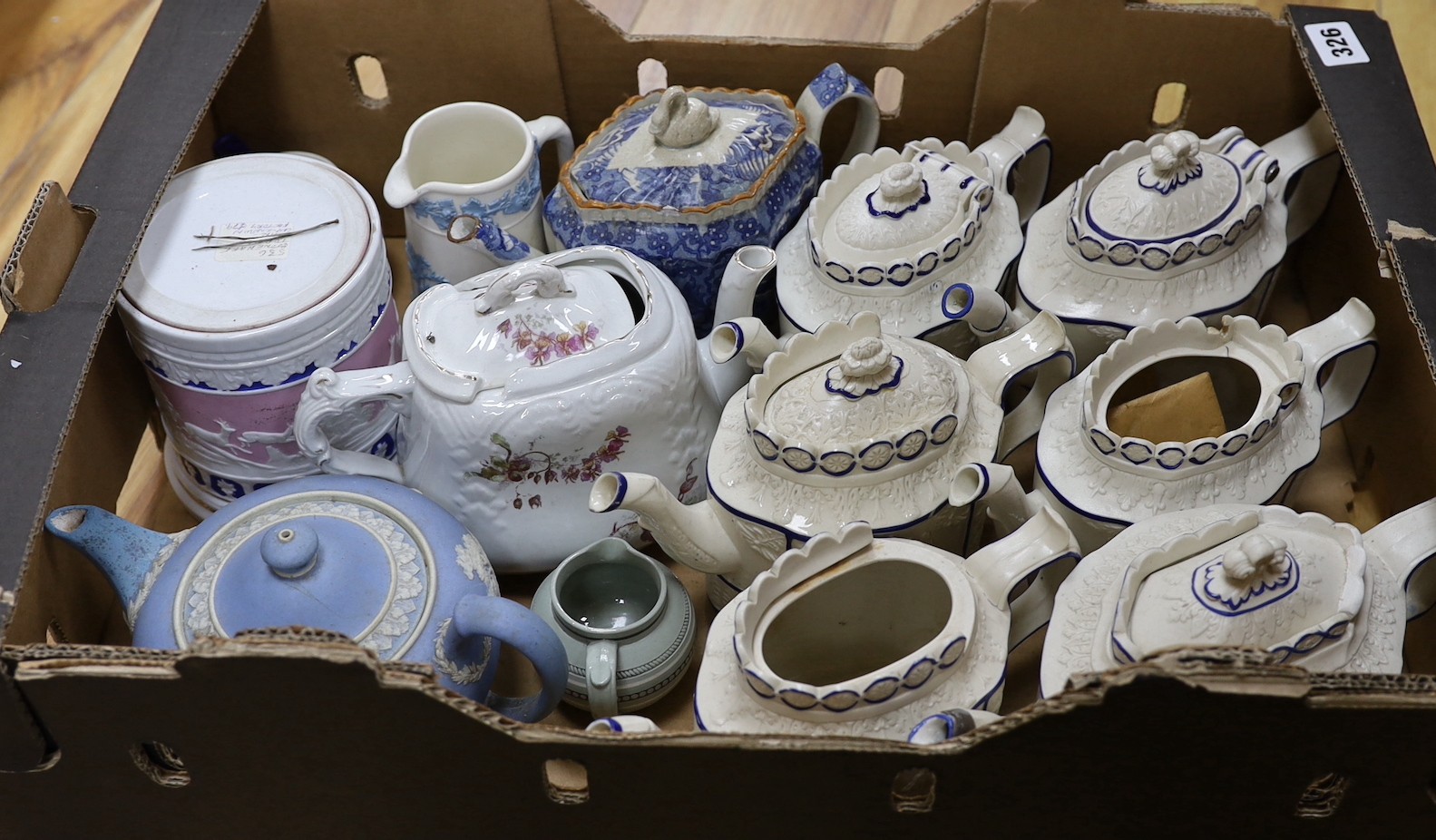 A quantity of various teapots including a pearlware teapot with swan finial, Castleford types, one Wedgwood